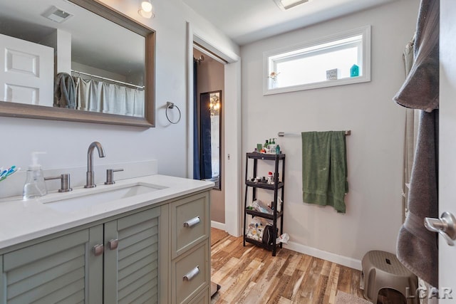 bathroom featuring hardwood / wood-style floors and vanity