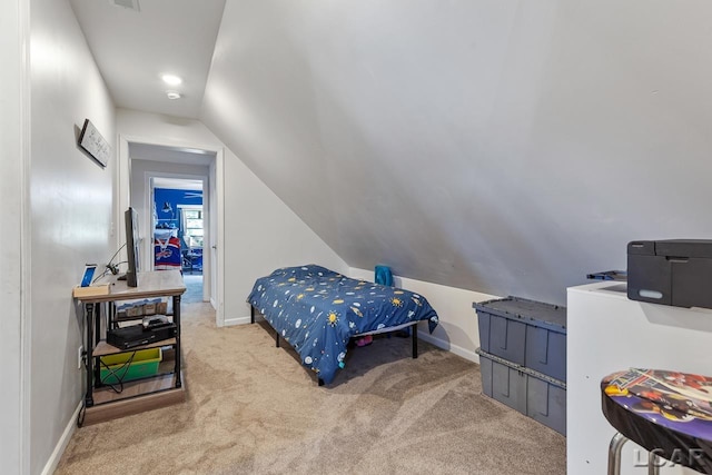 carpeted bedroom with vaulted ceiling