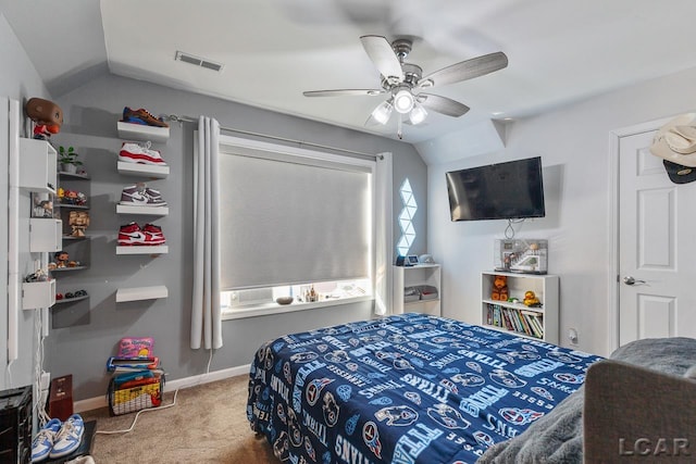 carpeted bedroom featuring vaulted ceiling and ceiling fan