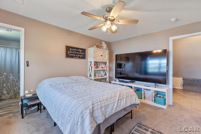 carpeted bedroom featuring ceiling fan