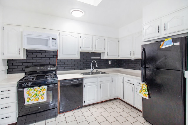 kitchen featuring white cabinets, sink, backsplash, and black appliances