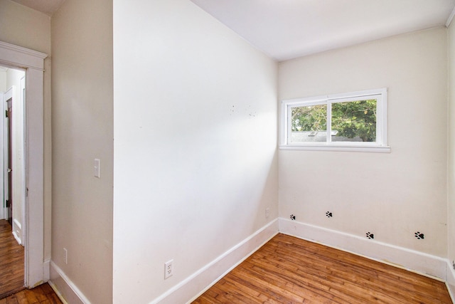 laundry room featuring gas dryer hookup and light hardwood / wood-style floors