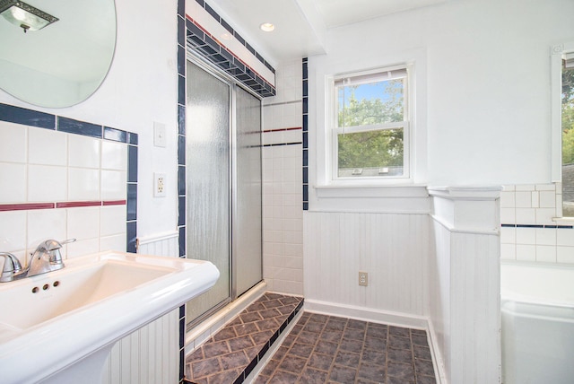 bathroom featuring sink and plus walk in shower