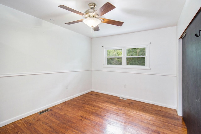 spare room featuring ceiling fan and hardwood / wood-style floors