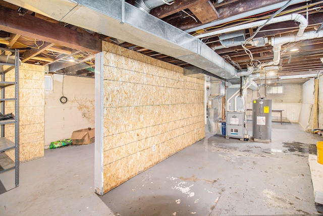 basement featuring heating unit and water heater