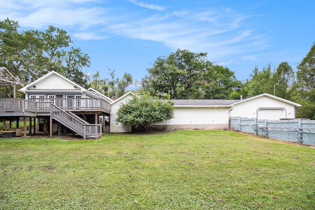 view of yard featuring a deck and a garage