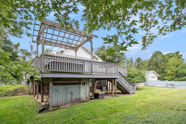 back of property featuring a deck and a yard