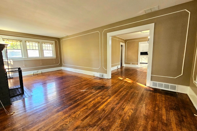 unfurnished room with hardwood / wood-style flooring