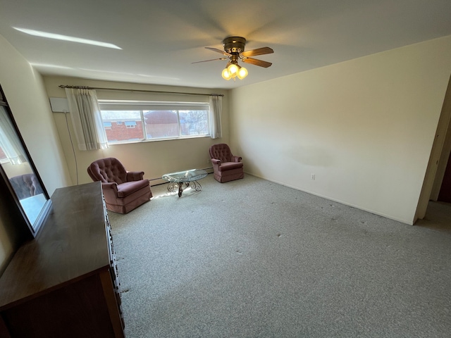 unfurnished room featuring ceiling fan and carpet