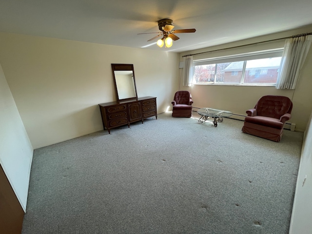 unfurnished room with carpet flooring, a baseboard radiator, and ceiling fan