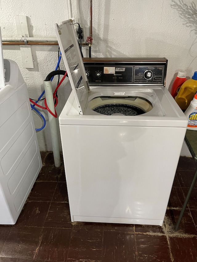 laundry area with washing machine and dryer