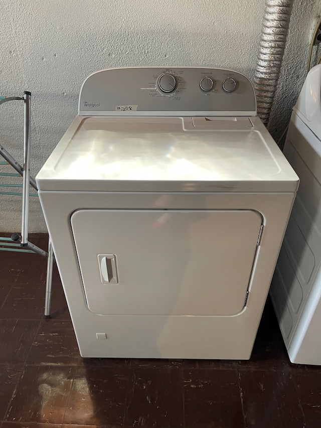 washroom with washer / dryer