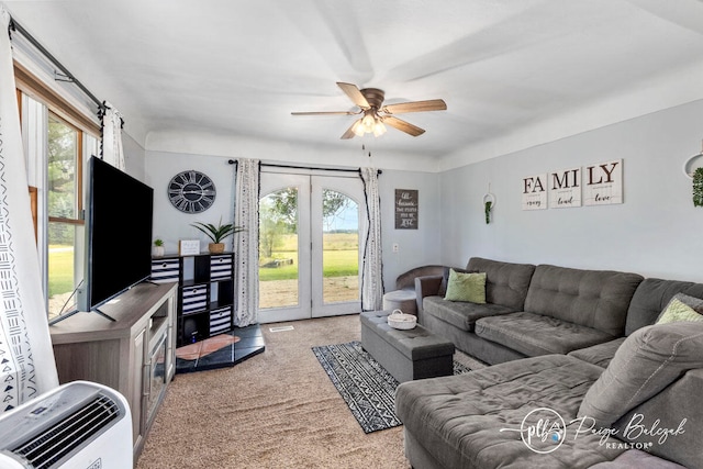 carpeted living room featuring heating unit and ceiling fan