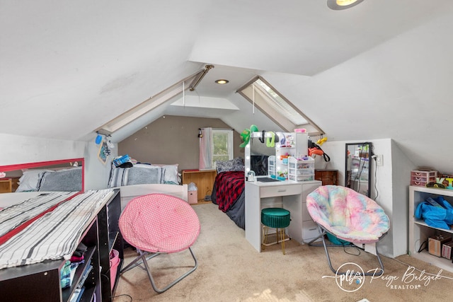 carpeted bedroom featuring lofted ceiling with skylight