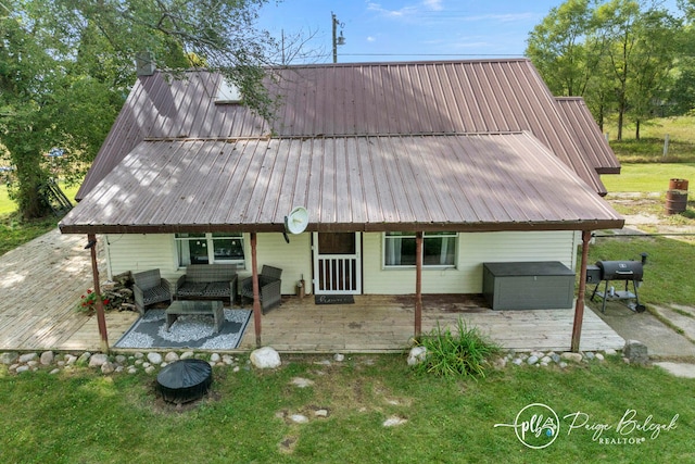 rear view of house with an outdoor hangout area and a patio