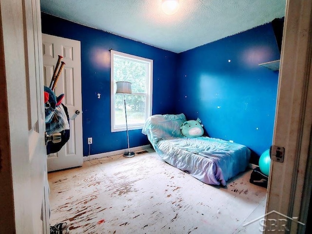 bedroom with a textured ceiling