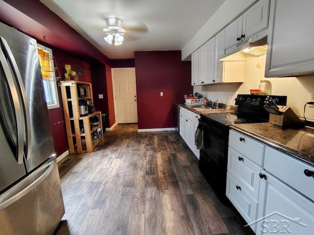 kitchen featuring black electric range, dark hardwood / wood-style floors, stainless steel fridge, ceiling fan, and white cabinetry