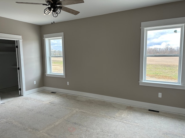 spare room with ceiling fan