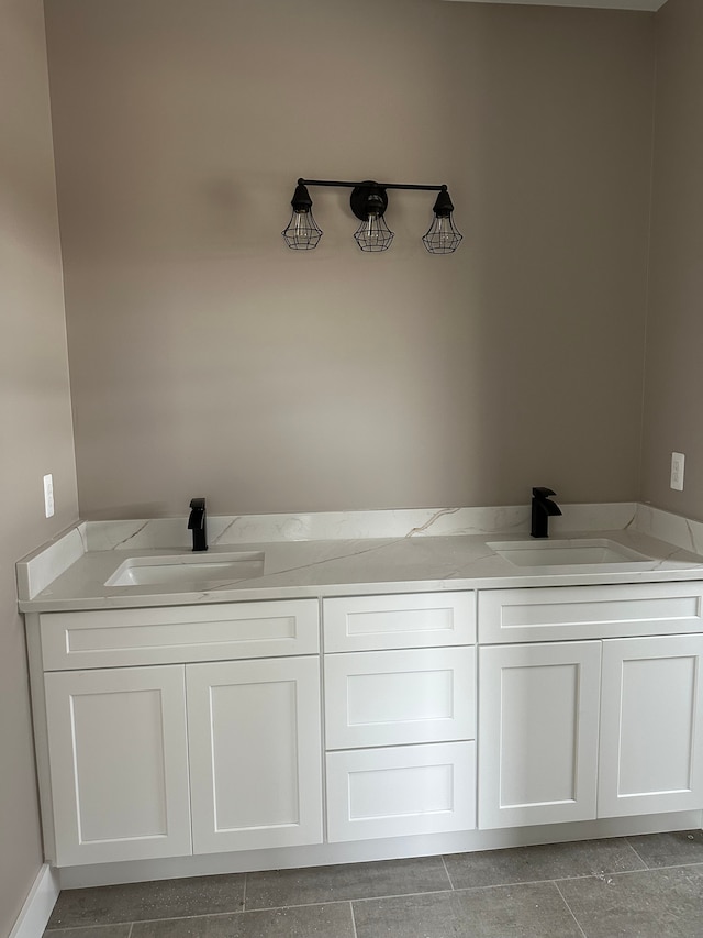 bathroom with tile patterned flooring and vanity