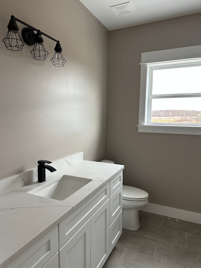 4625 Imlay City Rd, Attica, MI 48412 - bathroom with toilet, vanity, and baseboards