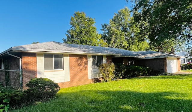 exterior space featuring a yard and a garage