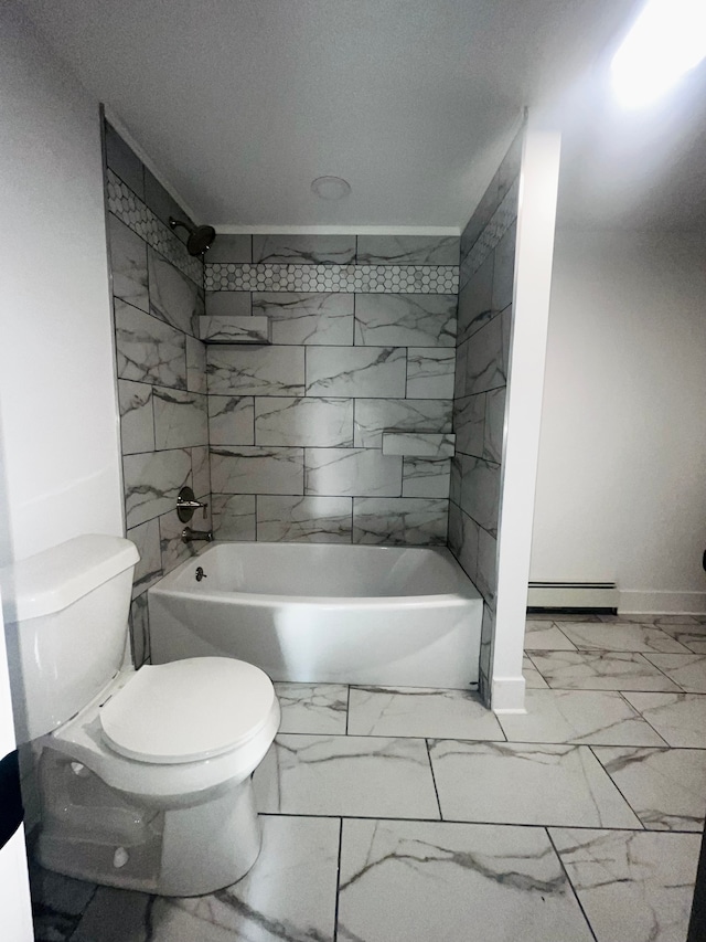 bathroom with tiled shower / bath combo and toilet