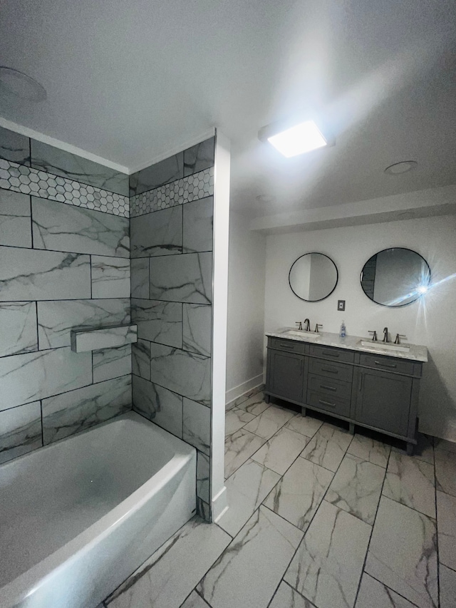 bathroom featuring vanity and tiled shower / bath