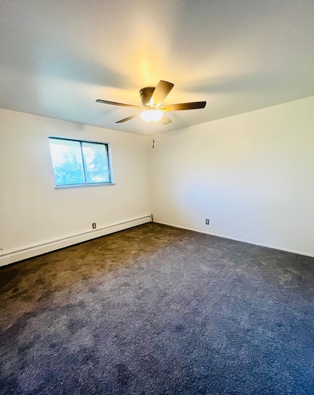 carpeted spare room with baseboard heating and ceiling fan