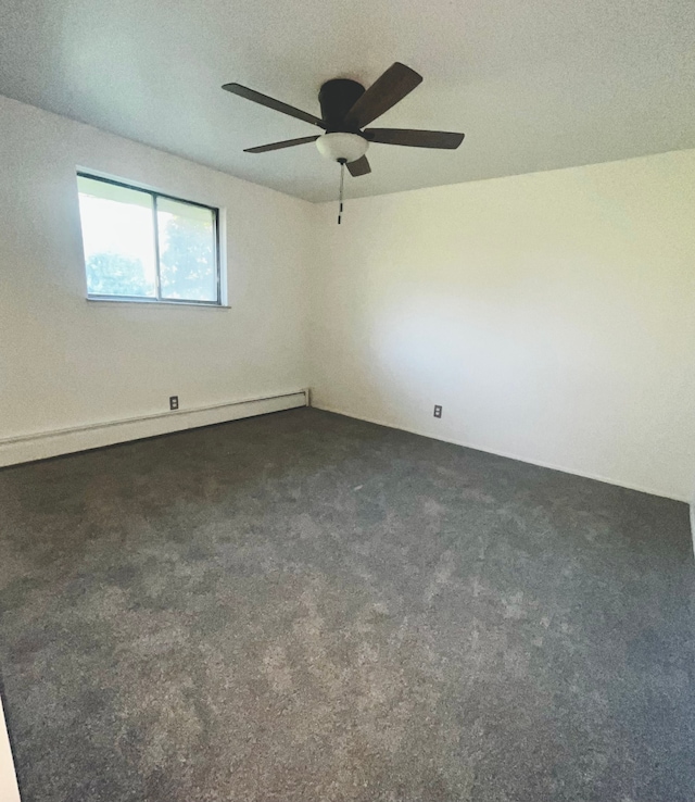 empty room featuring a textured ceiling, a baseboard radiator, dark carpet, and ceiling fan