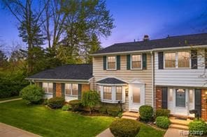 view of front of home with a yard