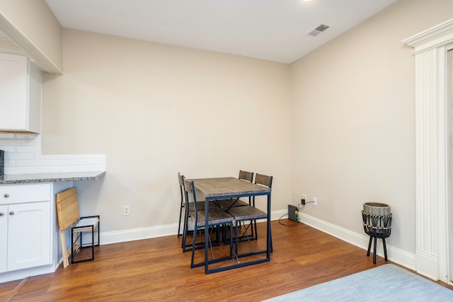 dining area with hardwood / wood-style flooring