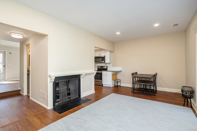 living room featuring dark hardwood / wood-style floors