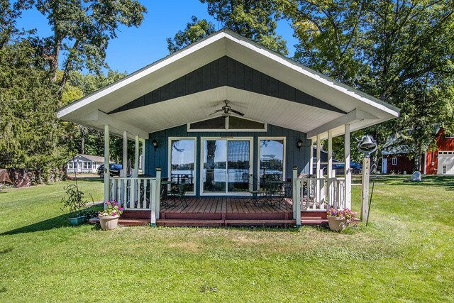 3055 E Baseline Rd, Gobles, MI 49055 - back of house with a ceiling fan, a yard, and a wooden deck