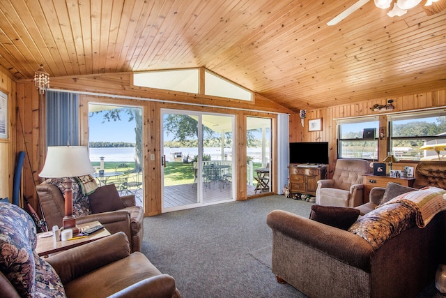 carpeted living room with lofted ceiling, wooden ceiling, and wooden walls