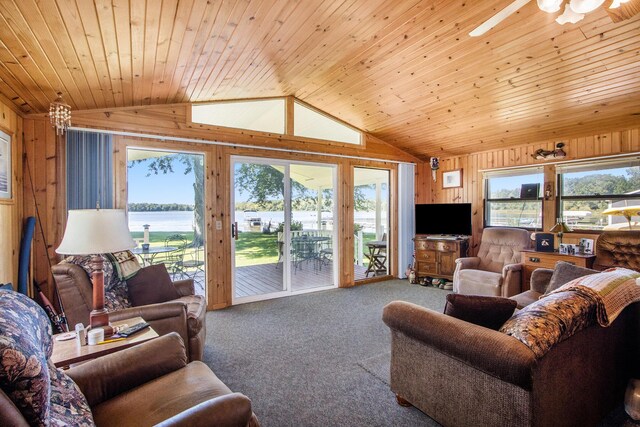3055 E Baseline Rd, Gobles, MI 49055 - carpeted living area featuring lofted ceiling, wood walls, plenty of natural light, wooden ceiling, and ceiling fan