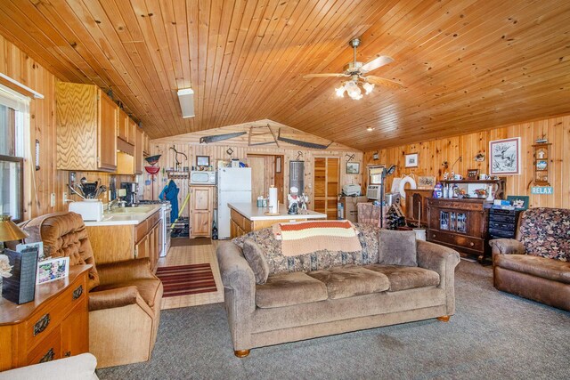 3055 E Baseline Rd, Gobles, MI 49055 - living area with lofted ceiling, wooden walls, light colored carpet, wooden ceiling, and a ceiling fan