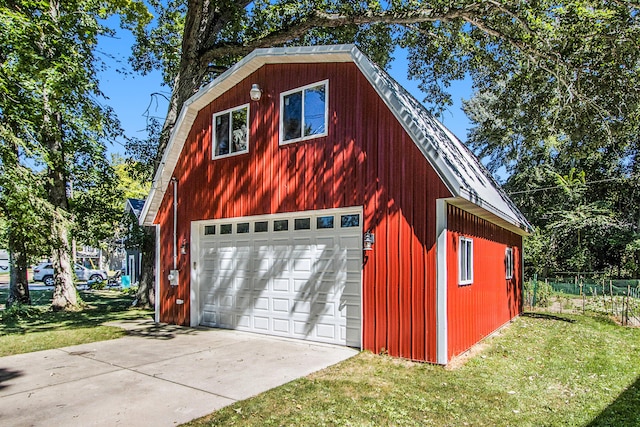 garage featuring a lawn