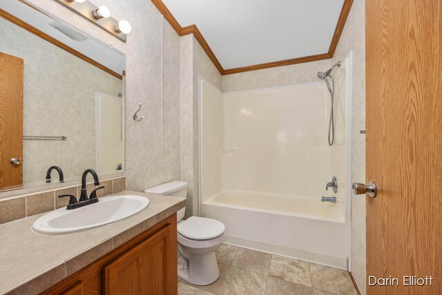 full bathroom featuring ornamental molding, toilet, shower / bath combination, and vanity