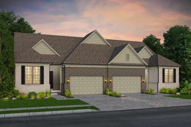 765 W Spaniel Dr, Ann Arbor, MI 48108 - view of front of property with concrete driveway, a shingled roof, a garage, and brick siding