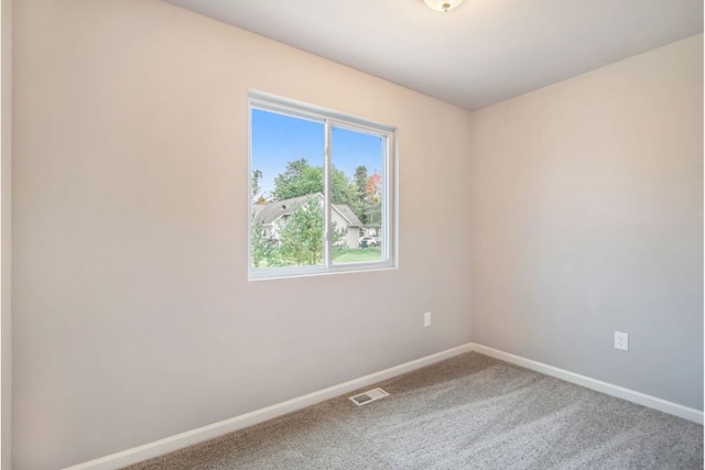 view of carpeted spare room