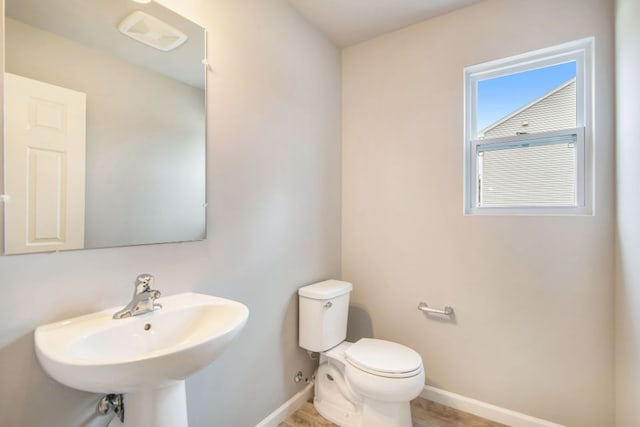 bathroom featuring toilet and sink