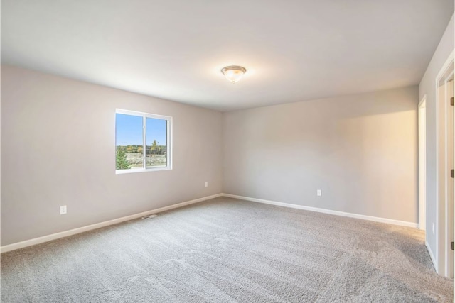 unfurnished room featuring carpet floors