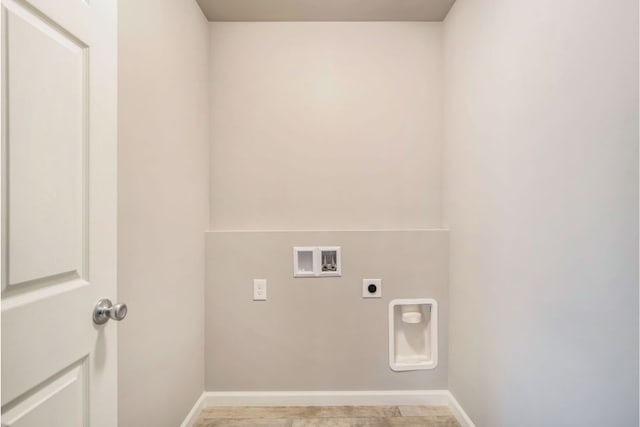 washroom with hookup for a washing machine and electric dryer hookup