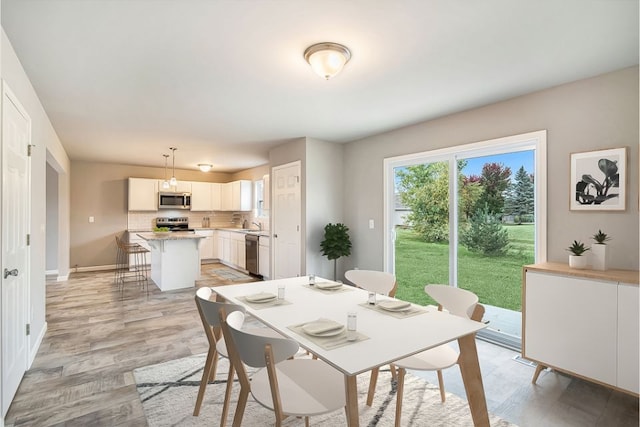 dining room featuring light hardwood / wood-style floors