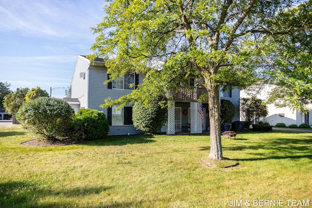 view of front of house featuring a deck and a front lawn