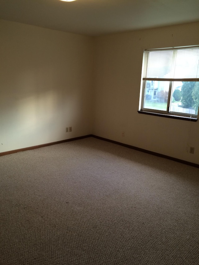 view of carpeted spare room