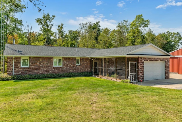 single story home with a sunroom, a garage, and a front yard