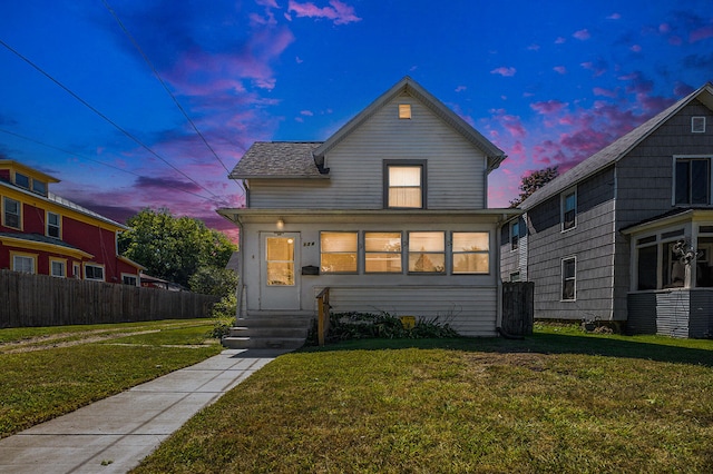 view of front of home featuring a lawn