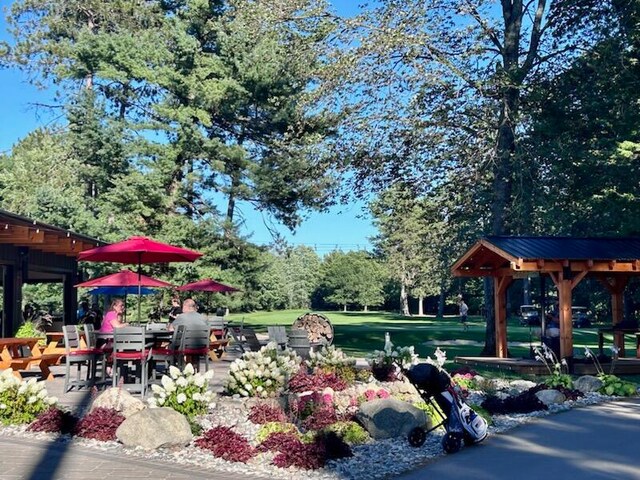 view of property's community featuring a yard