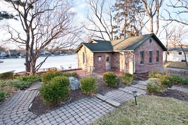 260 Oak Island Dr, Wolverine Lake, MI 48390 - view of property exterior featuring brick siding and a shingled roof